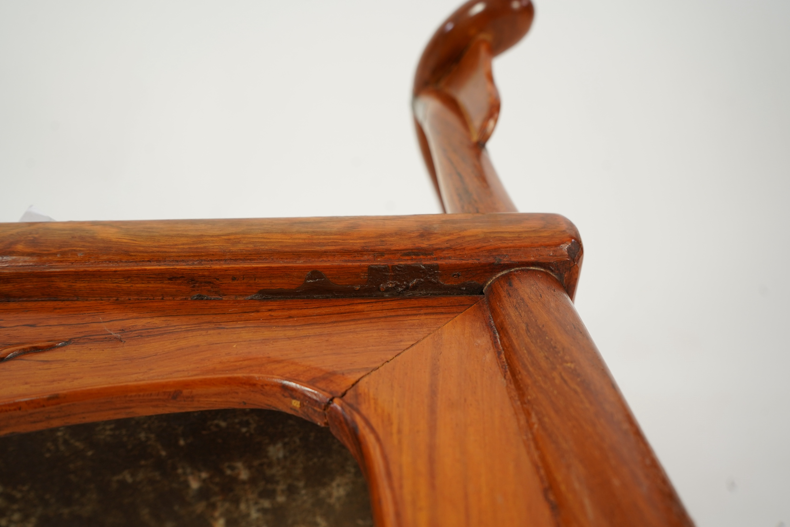 A Chinese huanghuali and brass mounted horseshoe-back armchair, quanyi, late 19th century